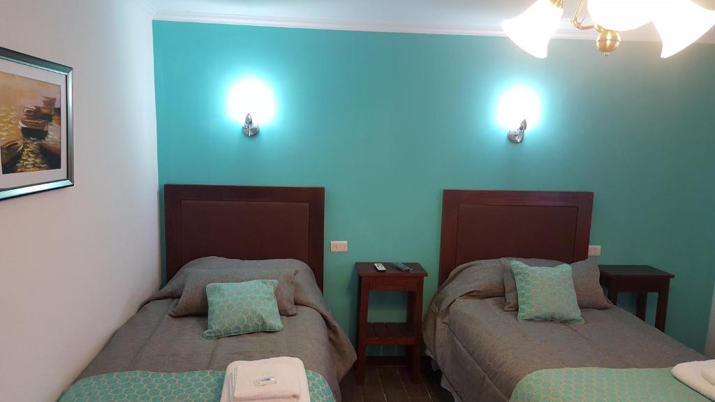 Comfortable bedroom at Hotel Che Cauquen, Puerto Santa Cruz, Patagonia